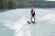 young woman water skiing on a lake