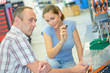 © auremar - Man and woman choosing in hardware store