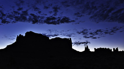 Wall Mural - Silhouettes of mountains on a desert at dawn