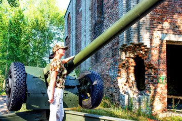 Artillery cannon at destroyed building.