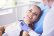 © lenets_tan - Young Female patient with pretty smile examining dental inspection at dentist office.