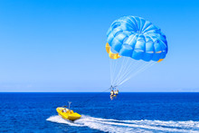 Blue Parasail Wing Pulled By A Boat. Sea Summer Recreation  - Cyprus.