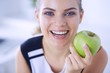© lenets_tan - Close up portrait of healthy smiling woman with green apple.