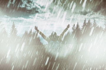 Girl praying for good weather on a rainy day.