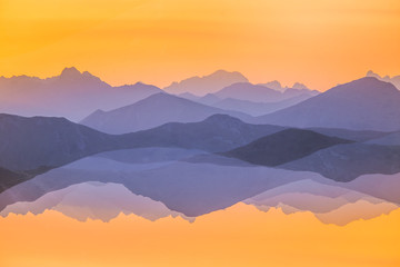 Colorful, abstract double exposure of mountains in sunrise. Minimalist scenery with color gradients. Tatra mountains in Slovakia, Europe.