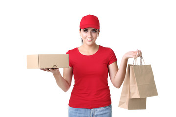 Delivery woman with cardboard box and paper bag on white background