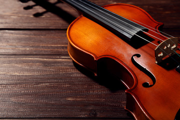 Wall Mural - Violin on brown wooden table