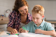 © Goran - Little boy sketching with his mother at home
