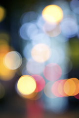 Wall Mural - Blurry background image of defocused colorful lights at night