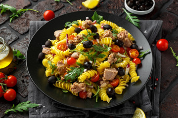 Pasta Tuna salad with tomatoes, wild rocket, black olives and red onion