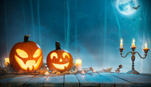 Spooky Halloween Pumpkins In Forest