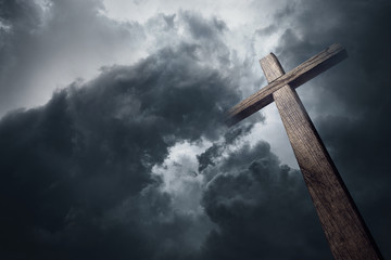 dramatic cloudscape and wooden cross