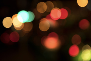 Wall Mural - Blurry background image of defocused colorful lights at night
