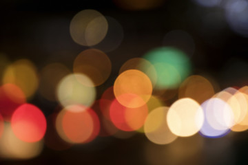 Wall Mural - Blurry background image of defocused colorful lights at night