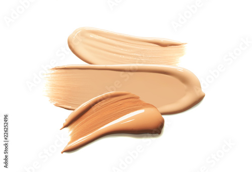 Fotografía BB CC foundation smudged cream white isolated background