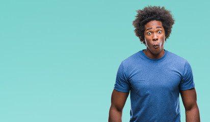 Wall Mural - afro american man over isolated background making fish face with lips, crazy and comical gesture. fu
