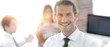 © ASDF - successful young business men on blurred background