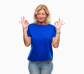 Sticker - Middle age blonde woman over isolated background relax and smiling with eyes closed doing meditation gesture with fingers. Yoga concept.