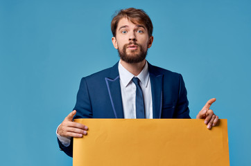 mockup, poster orange sheet of paper and a man in a suit