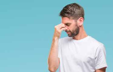 Poster - Young handsome man over isolated background tired rubbing nose and eyes feeling fatigue and headache. Stress and frustration concept.