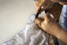 Thai Woman People Fold Bundle And Sewing Or Arashi Shibori On Fabric At Workshop In Nonthaburi, Thailand