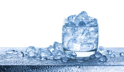 Wall Mural - water with crushed ice cubes in glass on white background