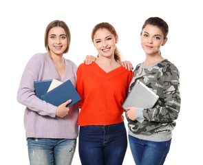 Canvas Print - Teenage girls with stuff for studying, isolated on white