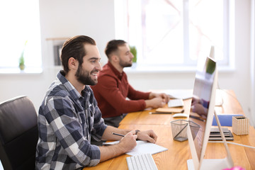 Poster - Young man working in office. Finance trading