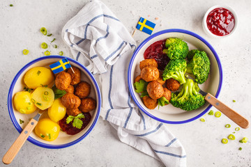 Wall Mural - Swedish meatballs with broccoli, boiled potatoes and cranberry sauce. Swedish  traditional food concept.