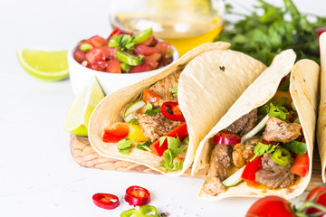 Wall Mural - Mexican pork tacos with vegetables and salsa.