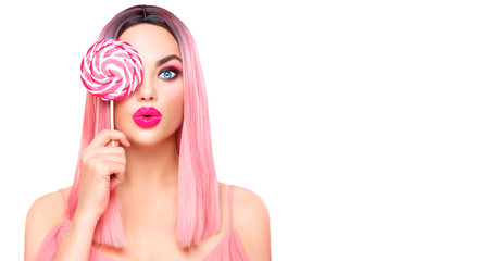 Poster - beauty sexy model woman with trendy pink hairstyle and beautiful makeup holding lollipop candy isola