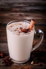 Sticker - Homemade Chai Tea Latte with anise and cinnamon stick in glass mug
