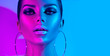 canvas print picture - Fashion model brunette woman in colorful bright neon lights posing in studio. Beautiful sexy girl, trendy glowing makeup, metallic silver lips