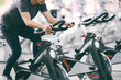Footage of a man working out in gym on the exercise bike, young man cycling in the gym. man exercising in fitness gym for good health.