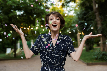 Sticker - Woman party outdoors in park having fun looking camera.