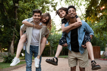 Sticker - Group of young friends party outdoors in park having fun.