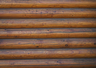 Large wooden logs - part of a building wall - wood background