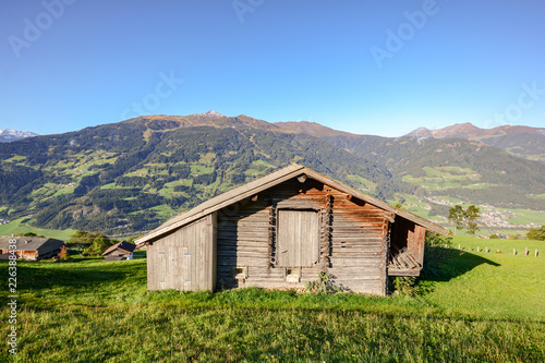 Alpine Pasture Hike To An Old Wooden Barn With Mountain Meadow In