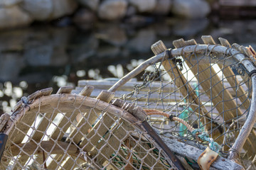 closeup lobster traps with blurred water background