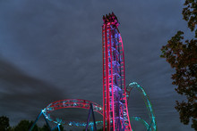 Illuminated Roller Coaster Ride At Night