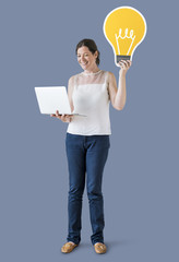 Poster - Woman holding an idea icon and using a laptop