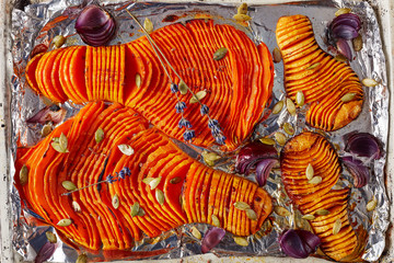 Wall Mural - close-up of sliced pumpkins baked in an oven