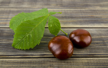 Wall Mural - chestnuts on a wooden table