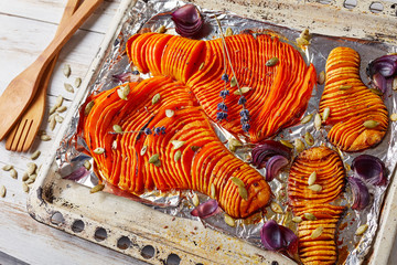 Wall Mural - close-up of sliced pumpkins baked in an oven