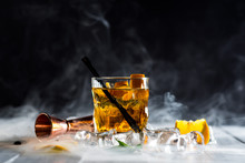 Whiskey Cocktail With A Smoke Called Smoking Gun At The Bar