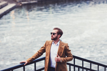 Wall Mural - portrait of a bearded stylish man in a bright coat