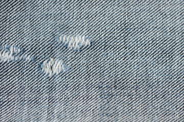 old blue jeans texture and background close up