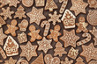 Homemade gingerbread house and gingerbread man cookies, festive Christmas and New Year sweeties background card, toned