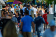 © Anton Gvozdikov - Unidentified crowd of people walking on the street at sunny day time
