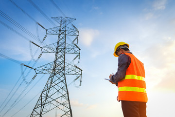 Engineering working on High-voltage tower, Check the information on paper.